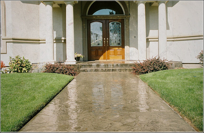 Stamped and colored concrete pour that's also freshly sealed