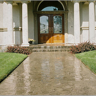 Stamped and colored concrete pour that's also freshly sealed