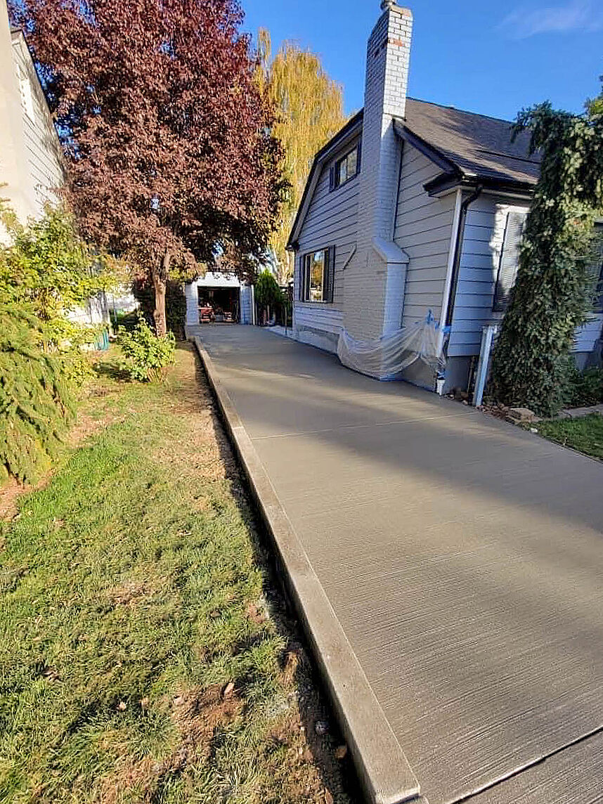 Newly replaced concrete driveway and curb