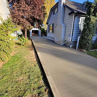 Newly replaced concrete driveway and curb