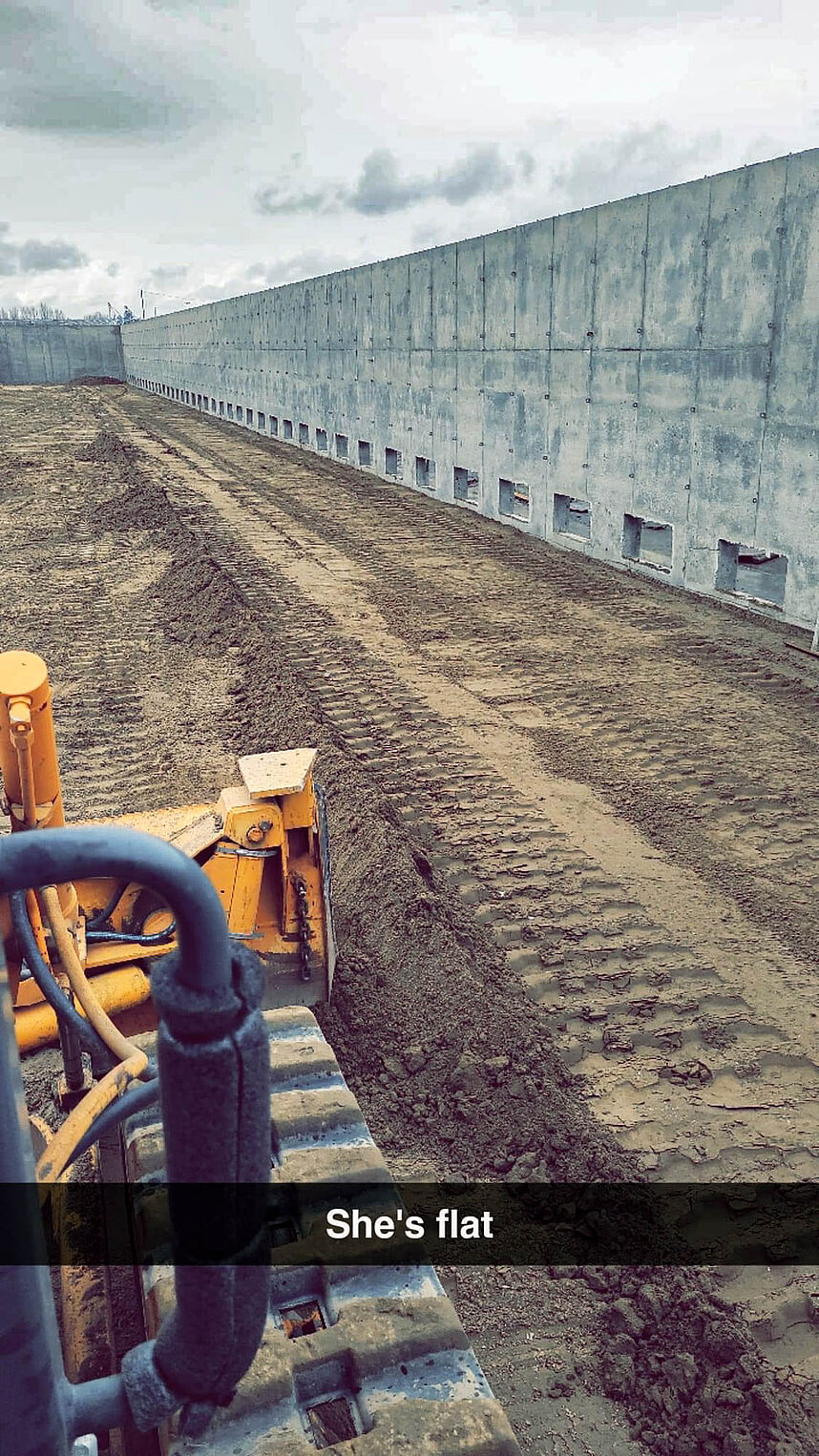 Prep for potato storage concrete slab after concrete walls