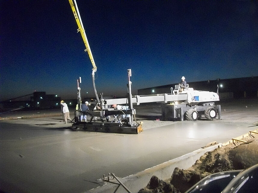 Pump truck working with Somero laser screed system on a new concrete pour